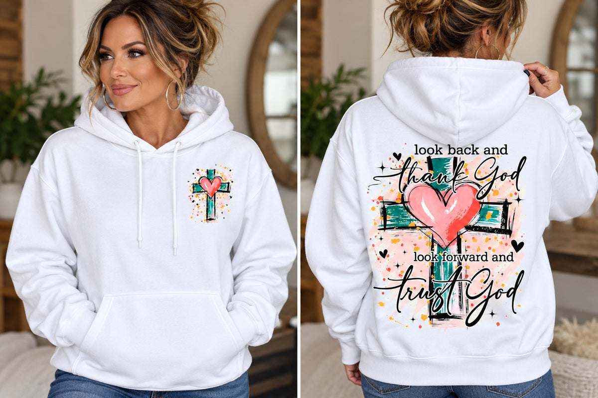 Woman modeling white hoodie with small front cross and heart and large Look Back and Trust God back design